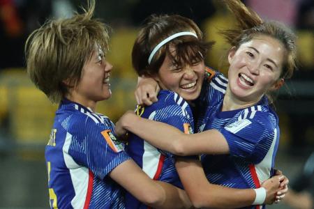 Japan's midfielder #07 Hinata Miyazawa (centre) celebrates with her teammates after scoring her team's third goal during the Australia and New Zealand 2023 Women's World Cup Group C football match. (AFP)