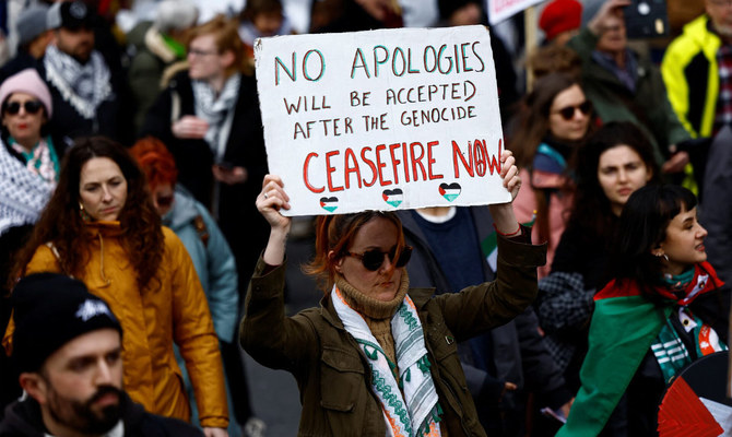 A demonstrators holds a sign in support of Palestine, amid the ongoing conflict between Israel and the Palestinian Islamist group Hamas, during a ‘Stand Together’ solidarity march against war, hate and racism, in Dublin, Ireland. (Reuters/File)